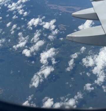 Photo taken out of an airplane above the clouds